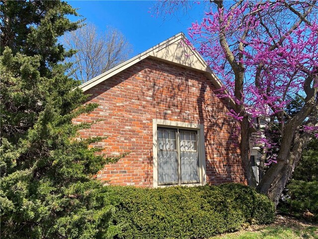 view of home's exterior featuring brick siding