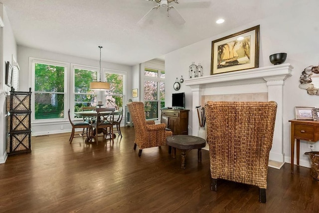 sitting room featuring wood finished floors, a ceiling fan, recessed lighting, and baseboards
