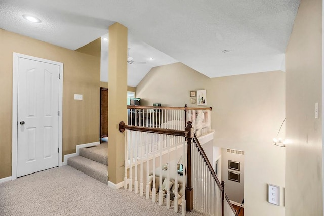 stairs with ceiling fan, baseboards, carpet flooring, vaulted ceiling, and recessed lighting