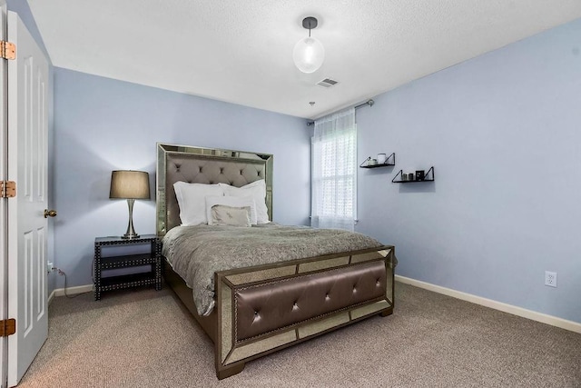 bedroom with baseboards and carpet floors