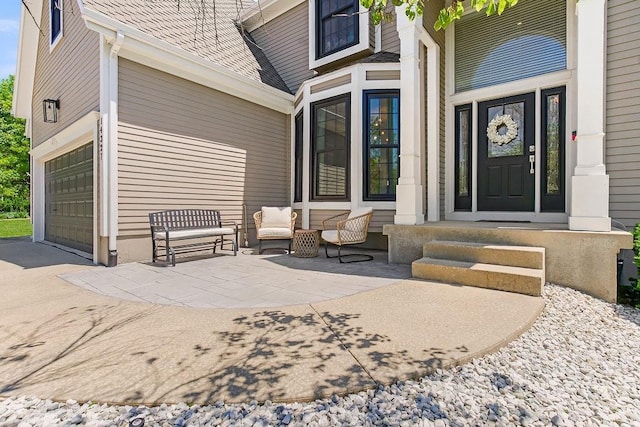 14327 King St, Overland Park, KS 66221 - property entrance with a garage, driveway, and a shingled roof