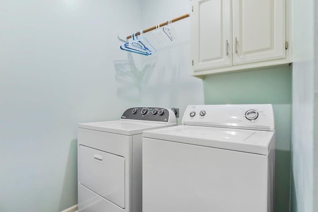 14327 King St, Overland Park, KS 66221 - laundry area featuring cabinet space and washing machine and dryer