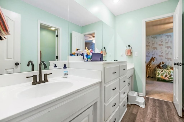 14327 King St, Overland Park, KS 66221 - bathroom featuring ensuite bath, wood finished floors, and vanity