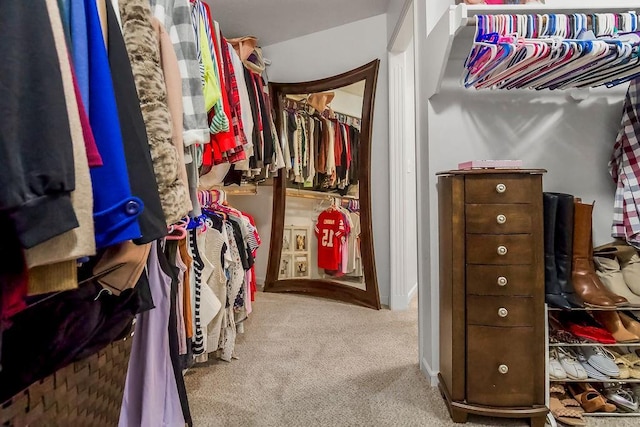14327 King St, Overland Park, KS 66221 - walk in closet featuring carpet