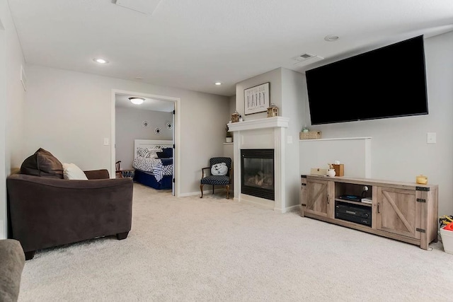 14327 King St, Overland Park, KS 66221 - carpeted living area with a glass covered fireplace, baseboards, and recessed lighting