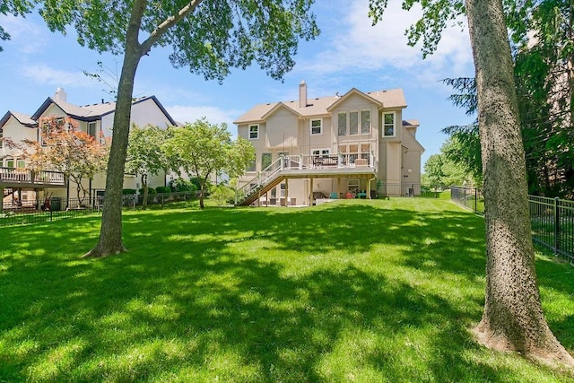 14327 King St, Overland Park, KS 66221 - rear view of house with stairs, a wooden deck, and stucco siding