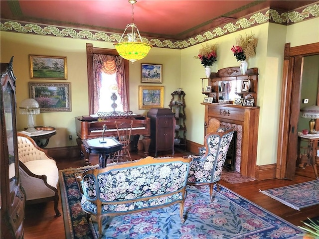 living area featuring wood finished floors and baseboards