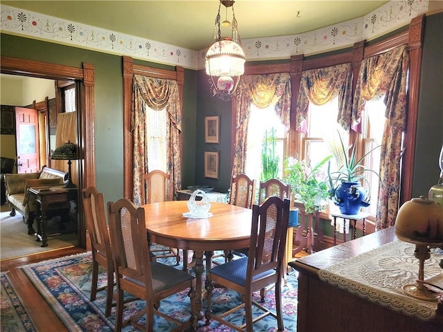 dining area with wood finished floors