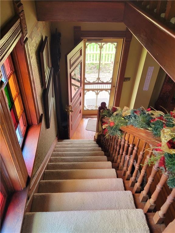 stairway featuring wood finished floors