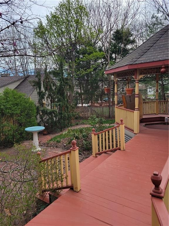 wooden deck featuring a gazebo