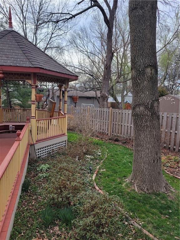 view of yard with a gazebo, fence, and a deck