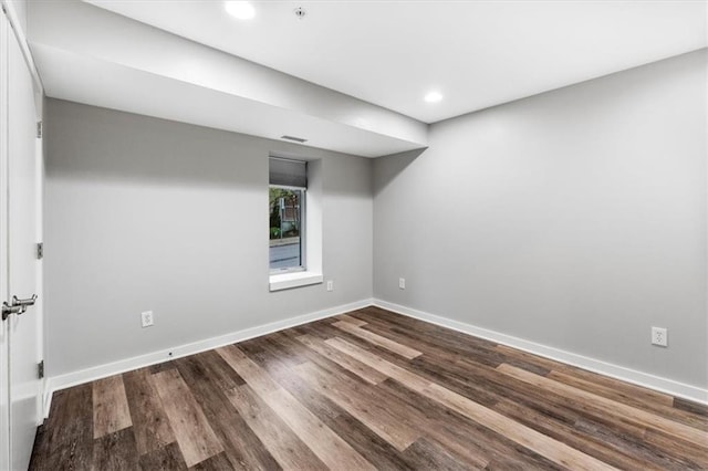 unfurnished room with recessed lighting, baseboards, and wood finished floors