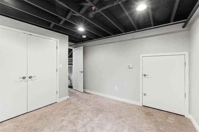 finished below grade area with carpet flooring and baseboards