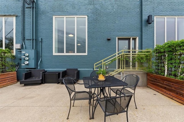 view of patio featuring outdoor dining area