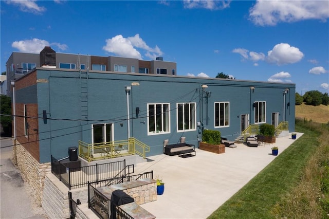 1605 Jefferson St, Kansas City, MO 64108 - back of house featuring a patio