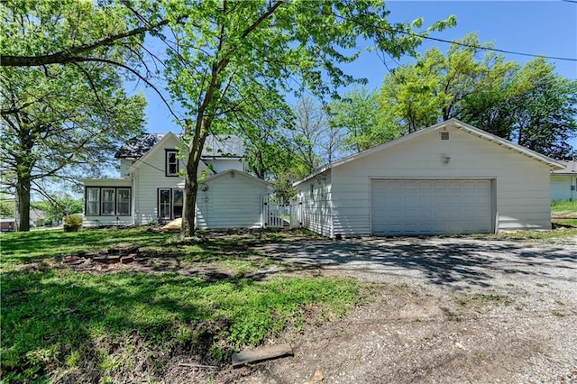 view of front of house with an outbuilding and a detached garage