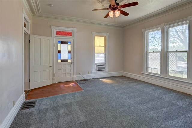 entryway featuring a wealth of natural light, visible vents, and carpet floors