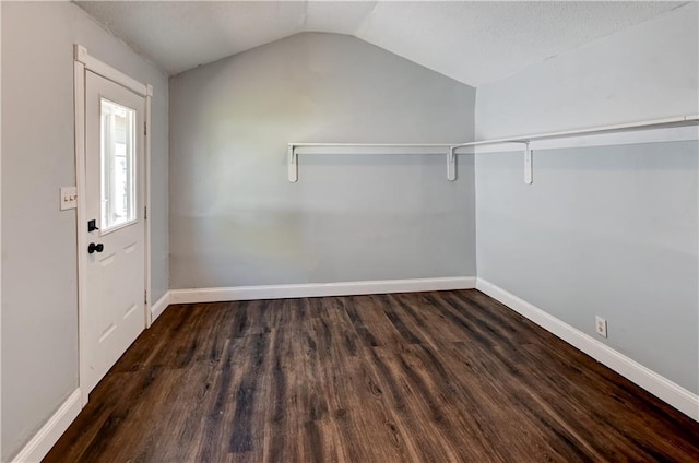 interior space with vaulted ceiling and wood finished floors