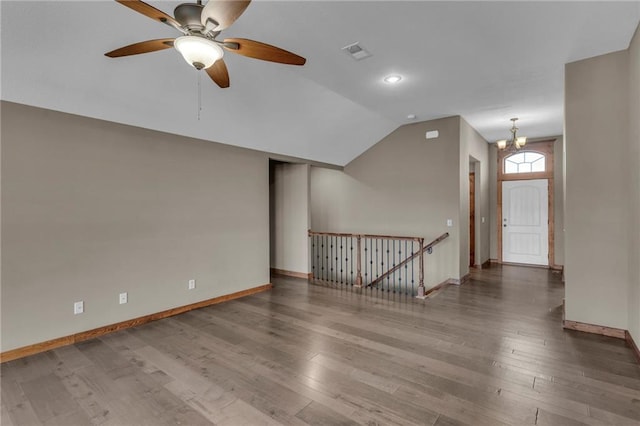 bonus room with lofted ceiling, visible vents, baseboards, wood finished floors, and ceiling fan with notable chandelier