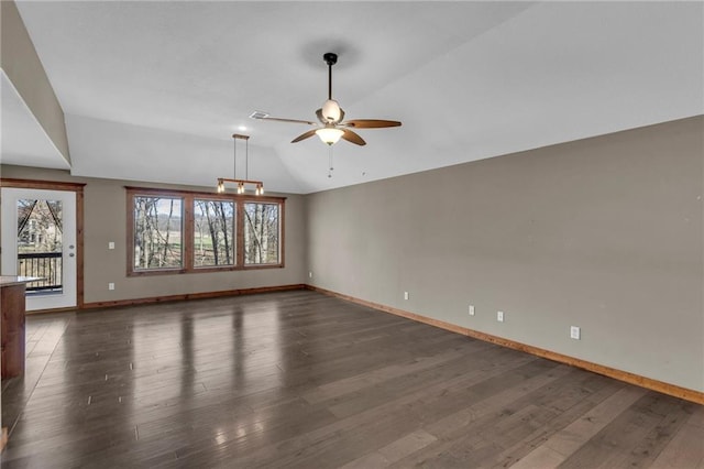 unfurnished room with dark wood finished floors, baseboards, a ceiling fan, and vaulted ceiling