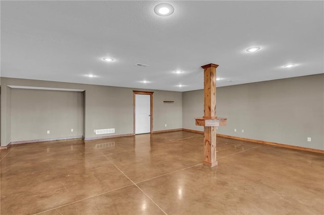 basement with baseboards, visible vents, and recessed lighting