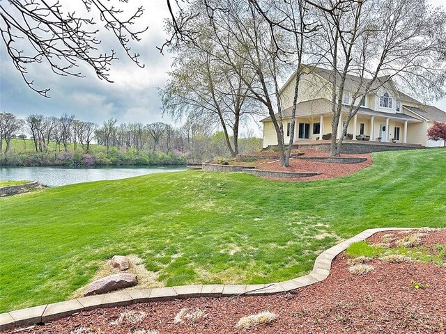 8225 NE 124th St, Kansas City, MO 64167 - view of yard with a porch and a water view