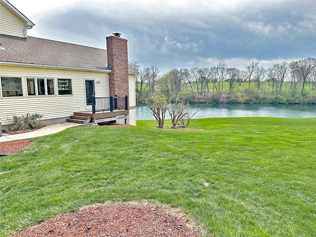 8225 NE 124th St, Kansas City, MO 64167 - view of yard featuring a deck with water view