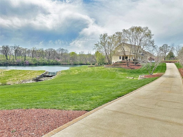 8225 NE 124th St, Kansas City, MO 64167 - view of home's community with a lawn and a water view