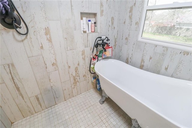 full bathroom featuring tile patterned floors and a soaking tub