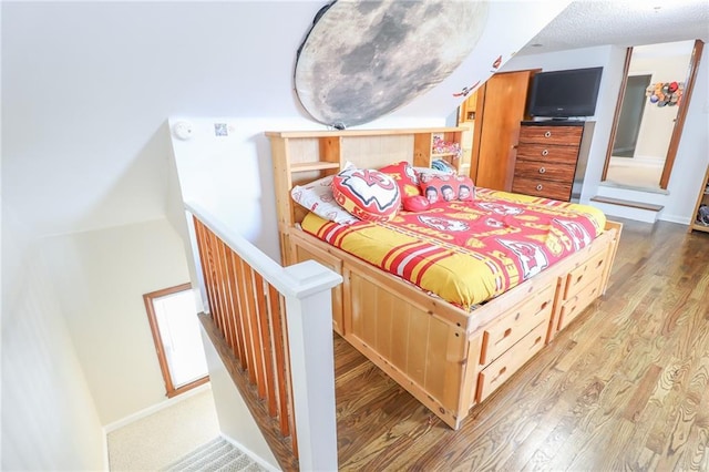 bedroom featuring light wood-style flooring and baseboards