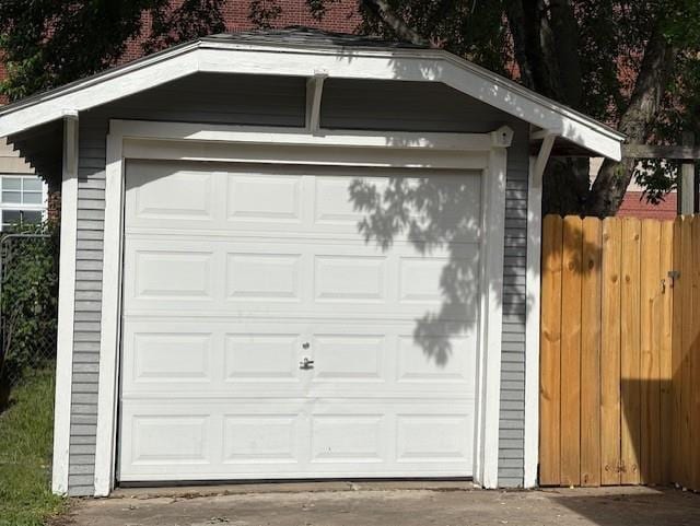 garage with fence