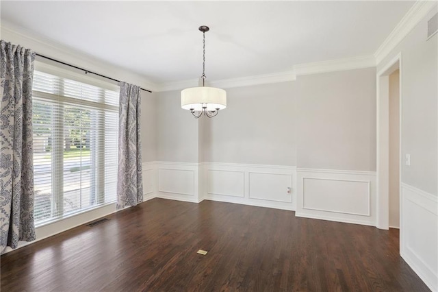 5329 Park St, Shawnee, KS 66216 - unfurnished dining area with a chandelier, healthy amount of natural light, wood finished floors, a wainscoted wall, and ornamental molding