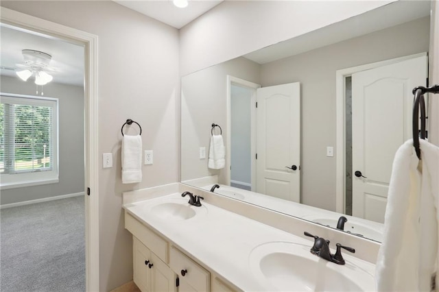 5329 Park St, Shawnee, KS 66216 - full bathroom featuring double vanity, ceiling fan, and baseboards