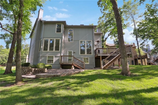 5329 Park St, Shawnee, KS 66216 - back of house featuring stairs, a wooden deck, a yard, and a chimney