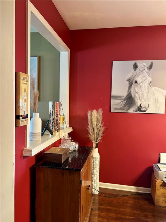 1519 Niagara St, Burlington, KS 66839 - bar with baseboards and wood finished floors