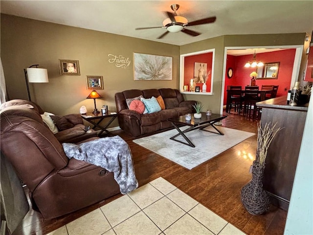 1519 Niagara St, Burlington, KS 66839 - living area featuring ceiling fan with notable chandelier and wood finished floors