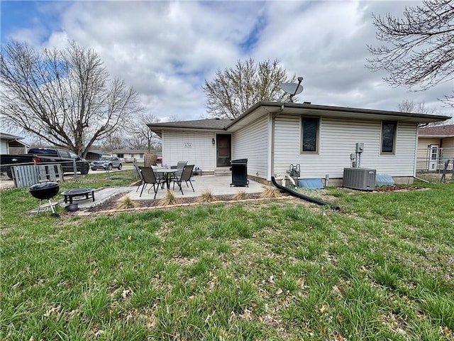 1519 Niagara St, Burlington, KS 66839 - back of house featuring a patio area, fence, central AC, and a yard