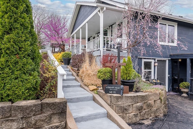 view of property exterior featuring stairway
