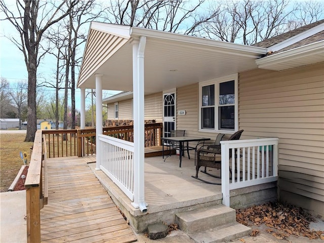 deck with outdoor dining space