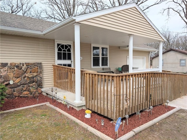 wooden deck featuring covered porch
