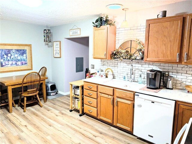 1804 S Phillips St, El Dorado Springs, MO 64744 - kitchen with a sink, light countertops, decorative backsplash, and dishwasher