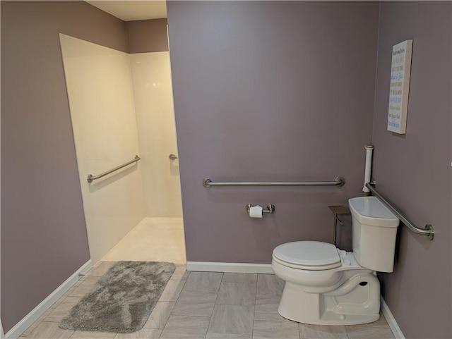full bath with baseboards, walk in shower, and toilet