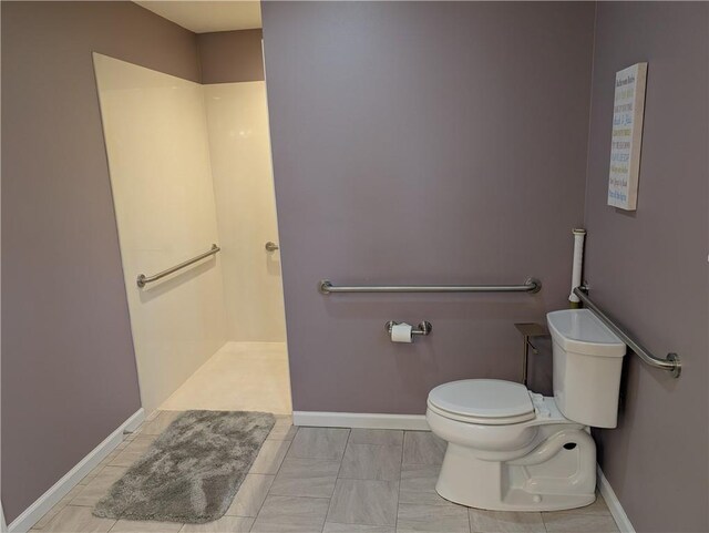 1804 S Phillips St, El Dorado Springs, MO 64744 - full bath with baseboards, walk in shower, and toilet