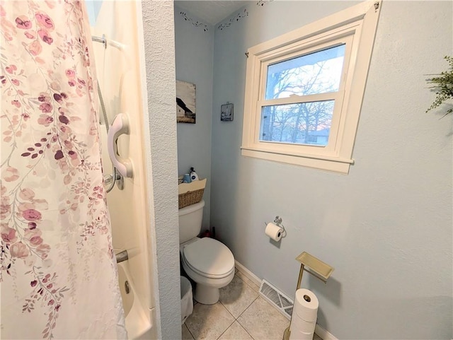bathroom featuring tile patterned flooring, toilet, baseboards, curtained shower, and visible vents
