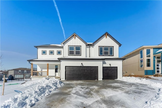 503 Woodview Dr, Raymore, MO 64083 - modern inspired farmhouse featuring a garage, covered porch, board and batten siding, and driveway
