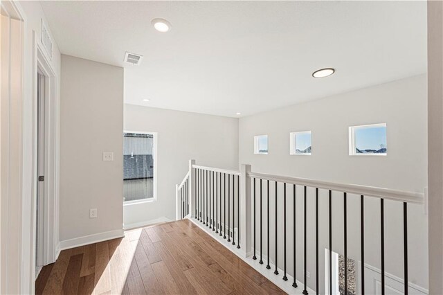 503 Woodview Dr, Raymore, MO 64083 - corridor with wood finished floors, recessed lighting, and baseboards