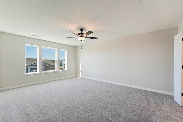 503 Woodview Dr, Raymore, MO 64083 - carpeted empty room with ceiling fan and baseboards