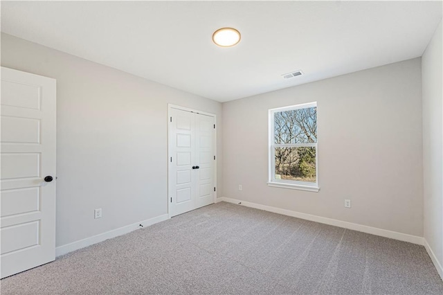 503 Woodview Dr, Raymore, MO 64083 - carpeted spare room with baseboards