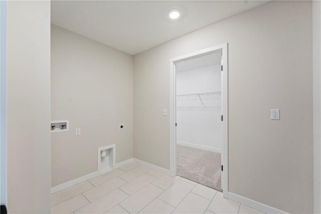 503 Woodview Dr, Raymore, MO 64083 - laundry room with electric dryer hookup, washer hookup, and baseboards