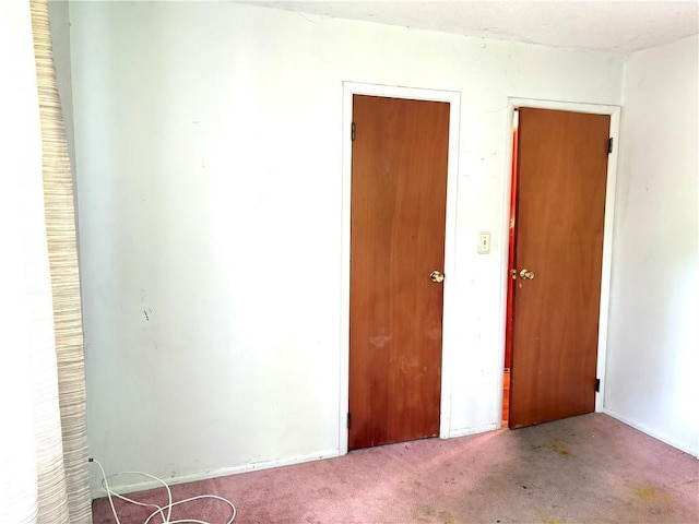 unfurnished room with carpet flooring
